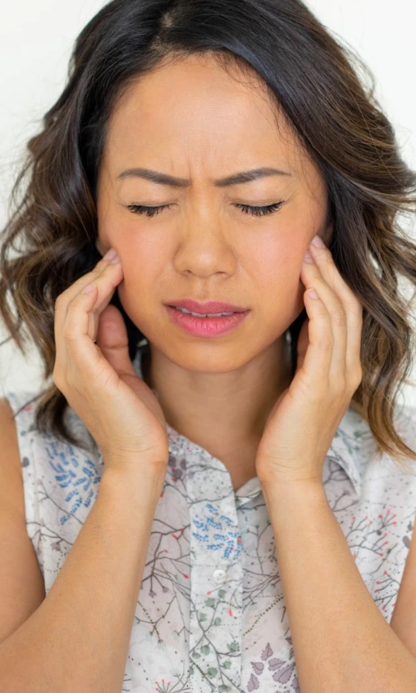 Asian Woman With A Toothache Needing Root Canal Treatment