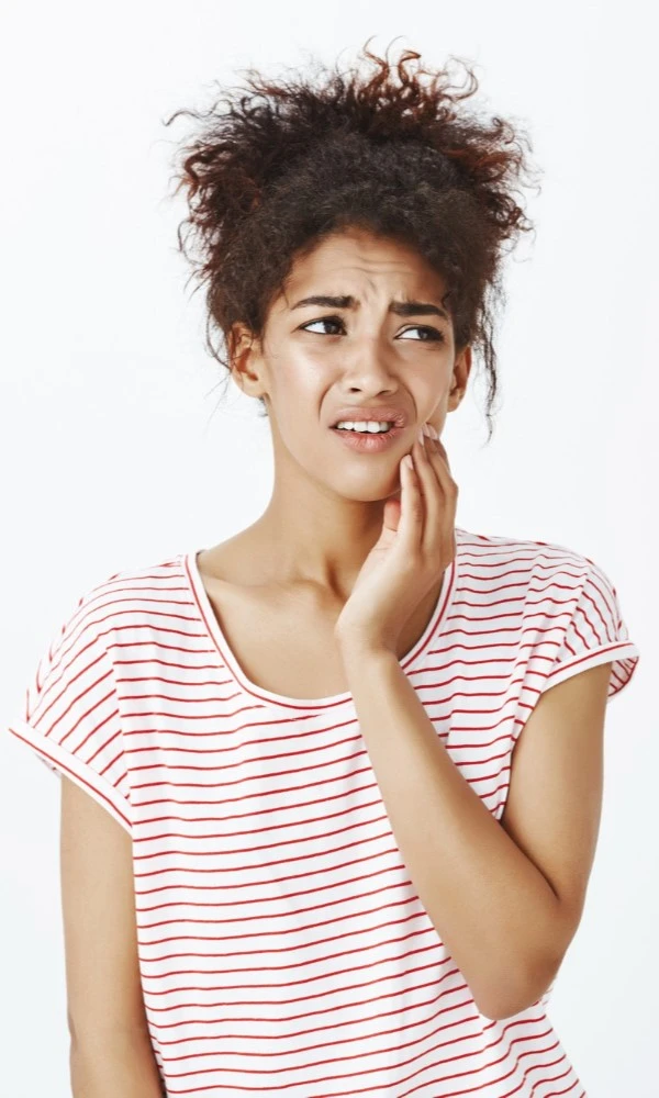 Woman With Afro Hair Needing Root Canal Treatment