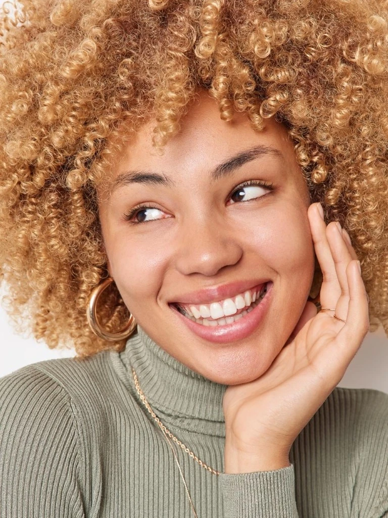 Woman With Afro Smiling With Teeth Whitening