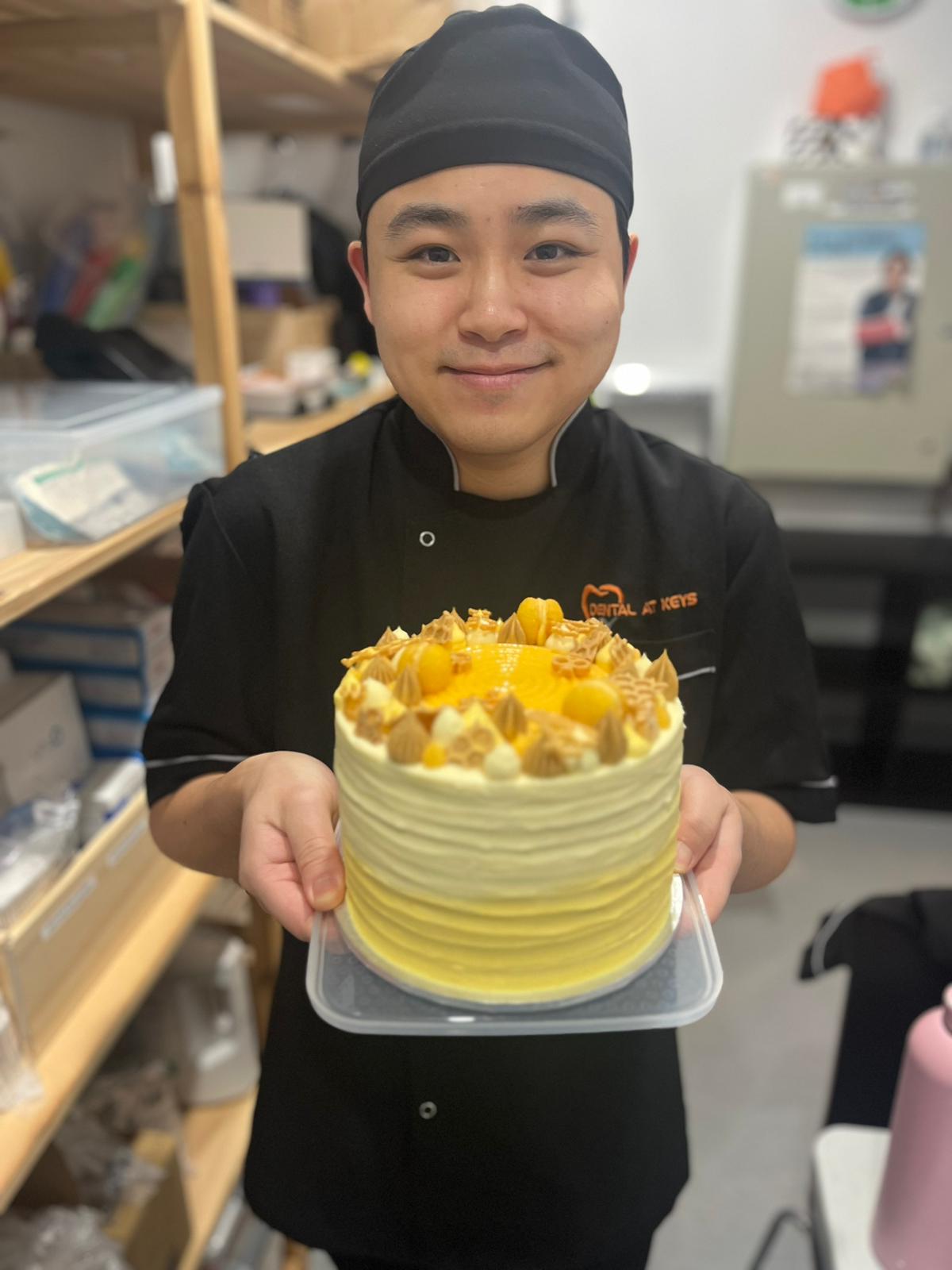 Dr Patrick Ta Holding A Yellow Cake