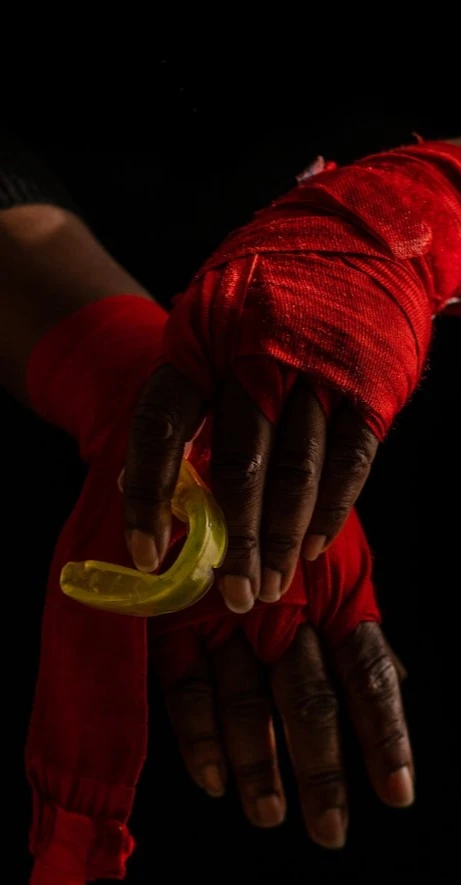 Red Hand Holding Sports Mouth Guard