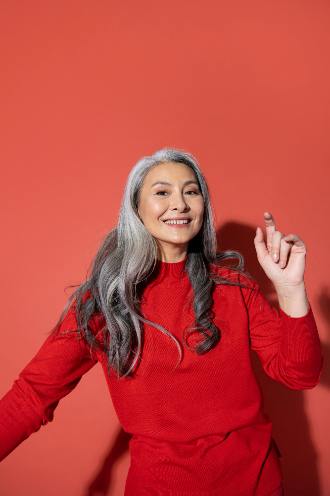 Smiling Older Asian Lady With A Dental Bridge