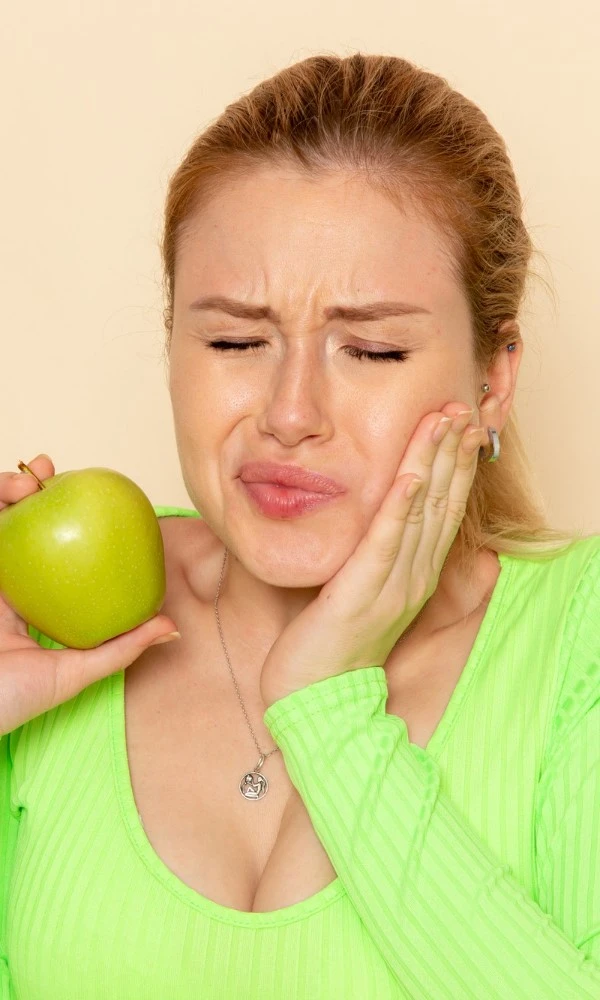 Woman In Green Shirt Cracked A Tooth On Apple