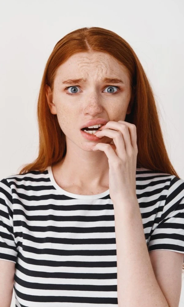 Woman With Red Hair Looking Worried