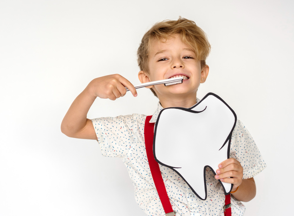 Toddler With Suspenders Showing Oral Health Tips